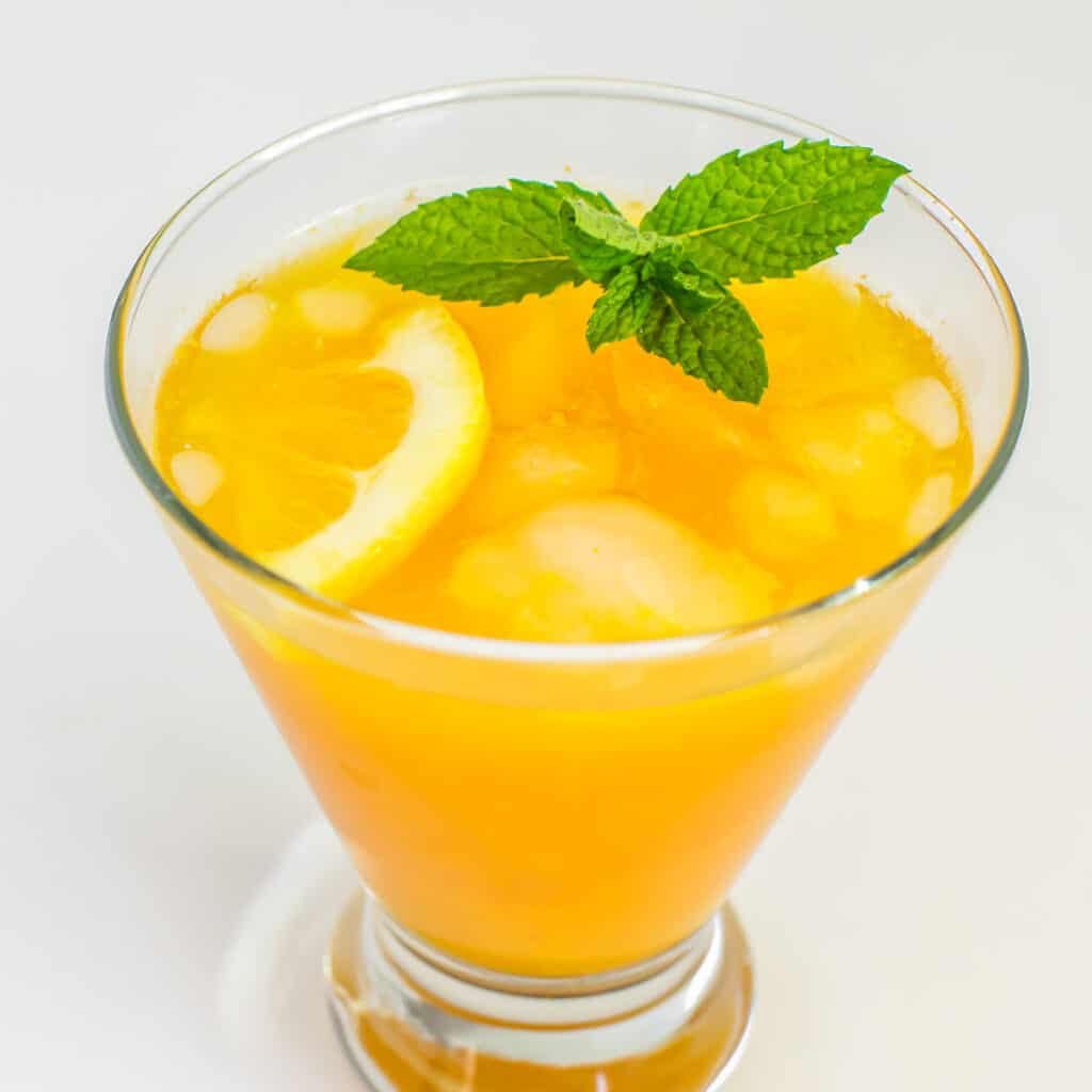 a 45 degree angle view of turmeric ginger lemonade.
