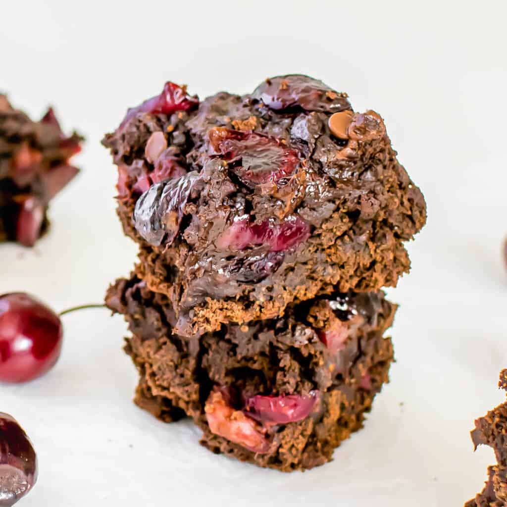 front view of stacked chocolate cherry brownies. 
