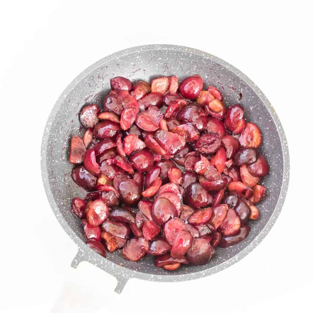 cooked cherries in a pan.