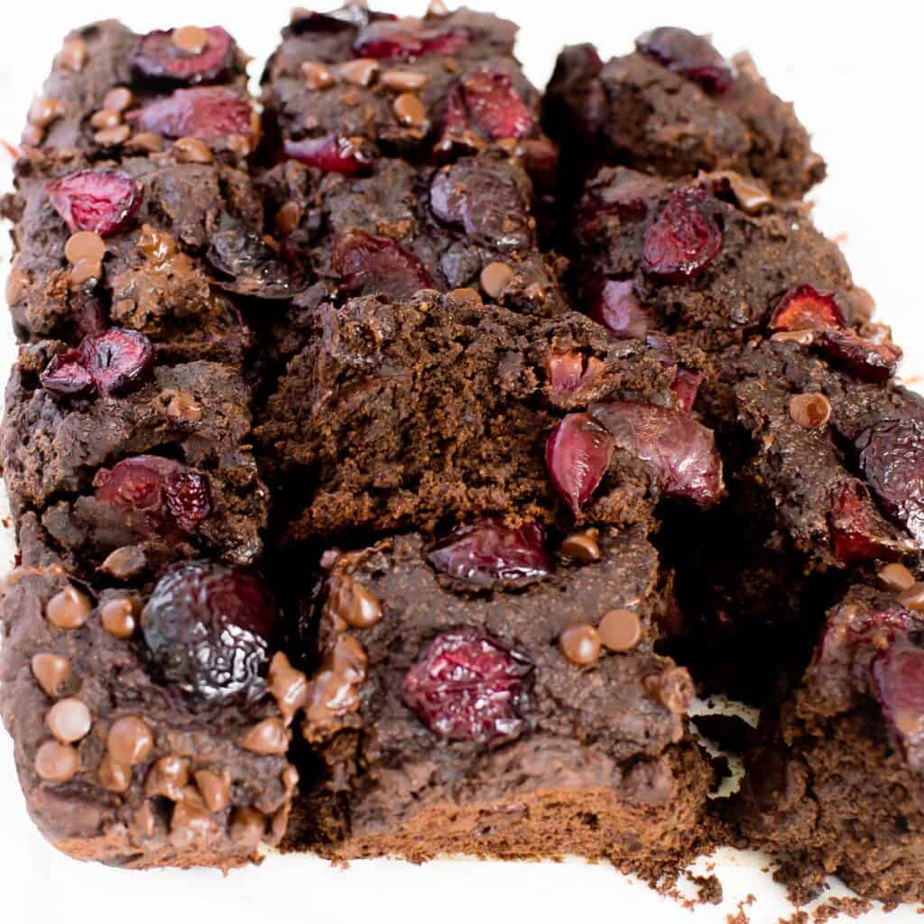 a 45 degree angle view of the inside of chocolate cherry brownies.