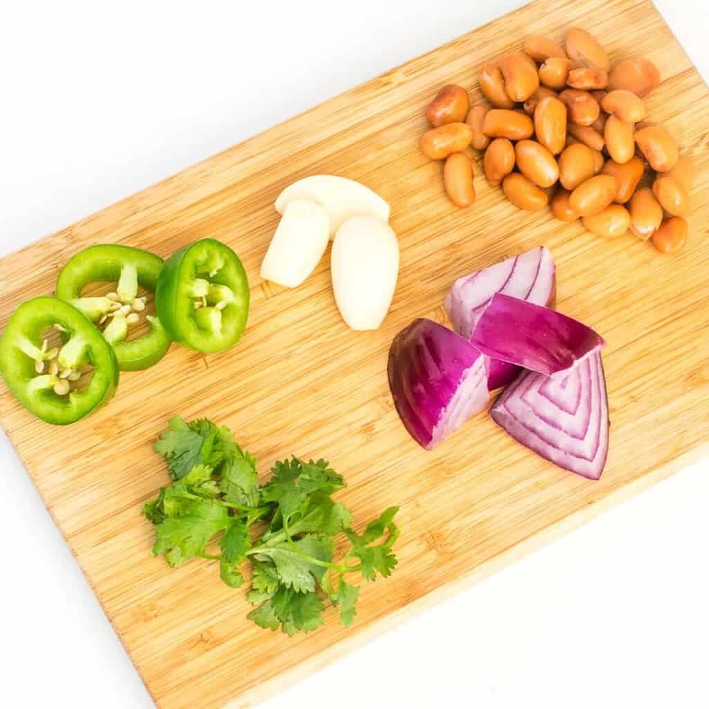 top view of raw ingredients on a wooden board.