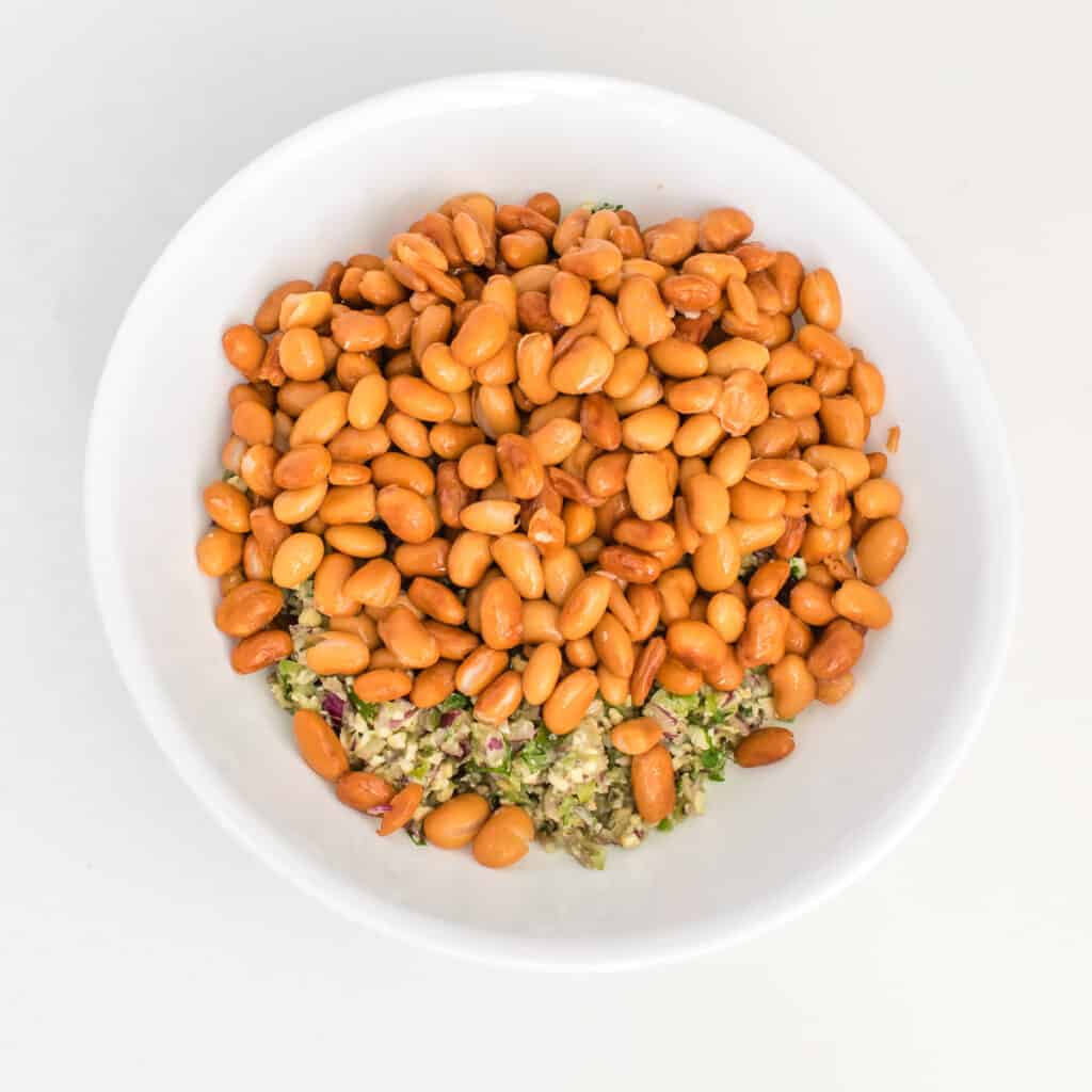 pinto beans with other ingredients in a bowl.