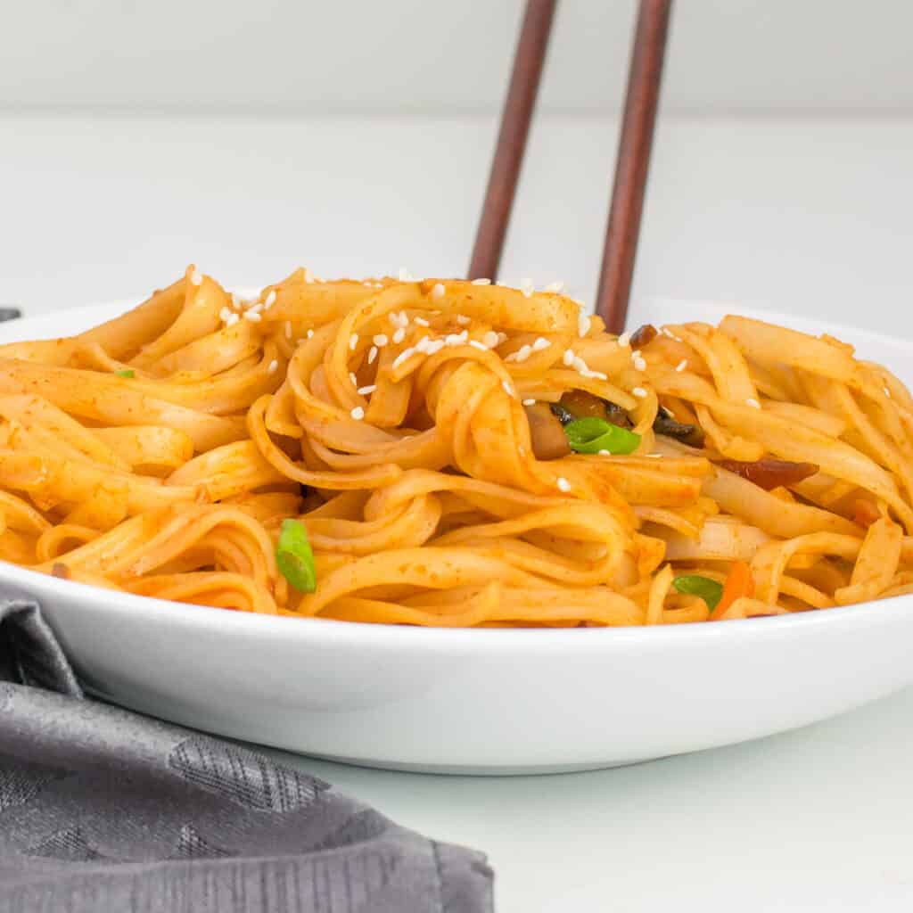 front view of served gochujang noodles in a bowl. 