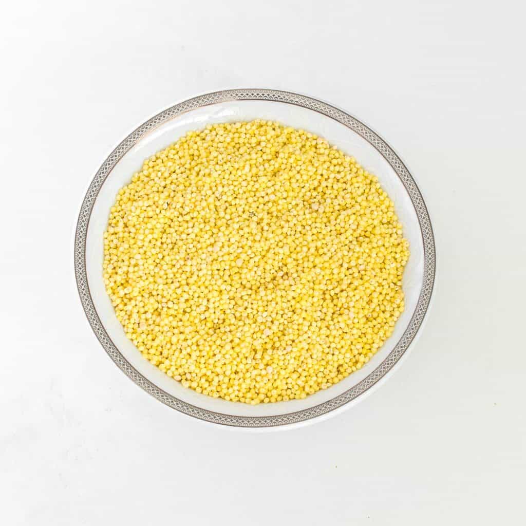 raw millet in a bowl. 