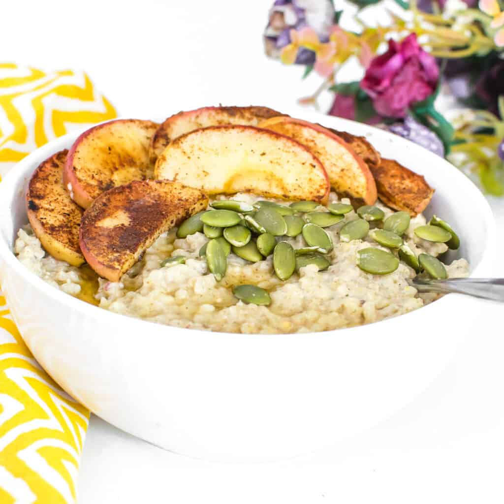 front view of millet porridge with toppings and served in a bowl. 