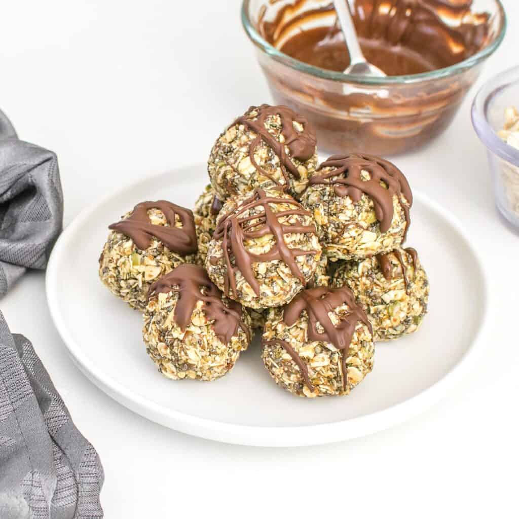 a 45 degree angle view of stacked no bake oatmeal protein balls. 