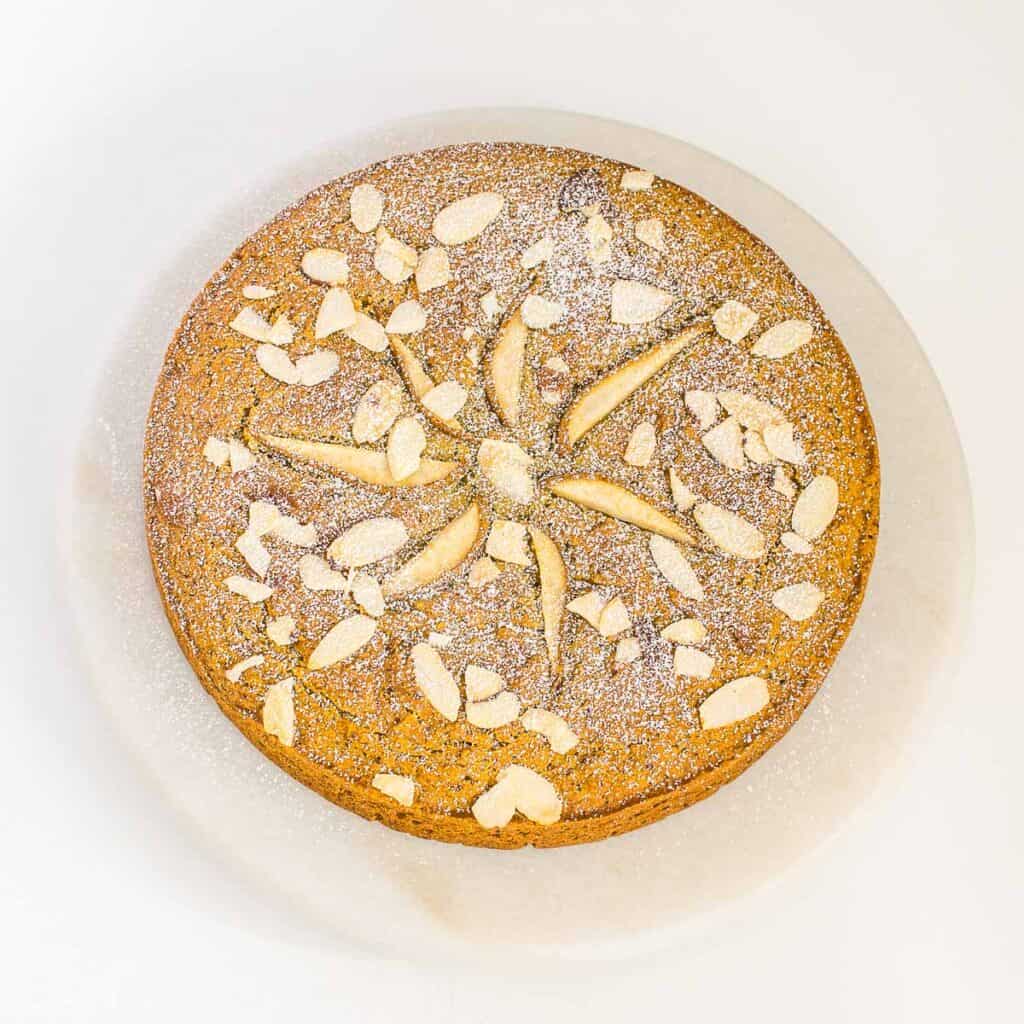 full top view of the garnished vegan pear cake. 
