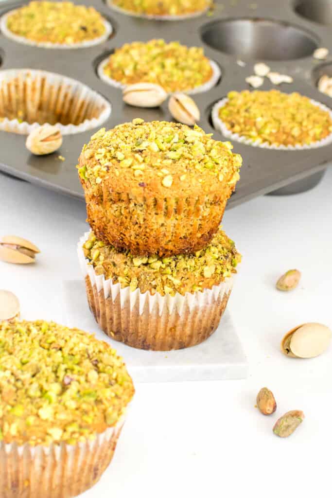 front view of stacked pistachio muffins. 