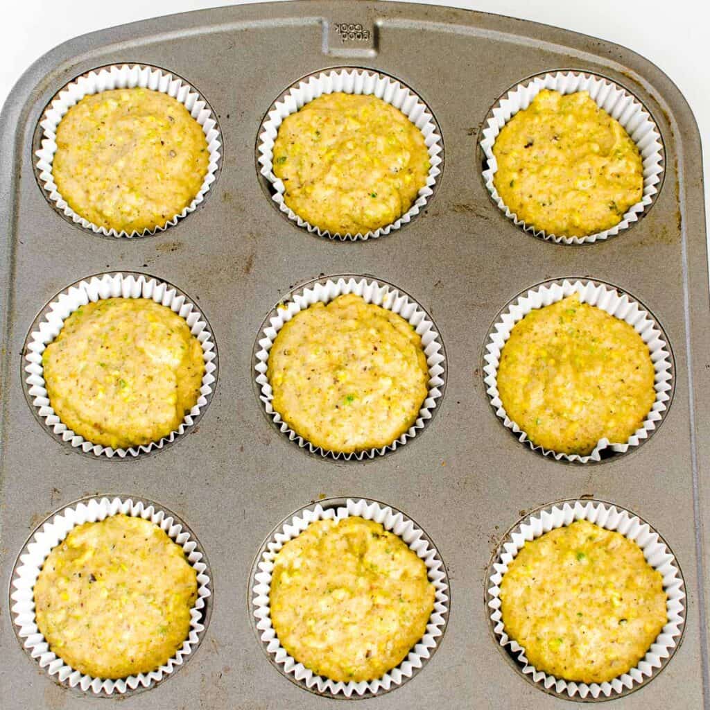 muffin tray filled with the batter and ready to be baked. 