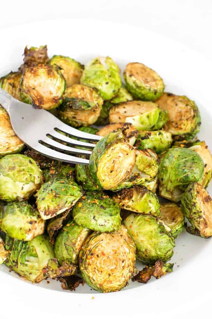 a fork with air fryer brussels sprouts. 