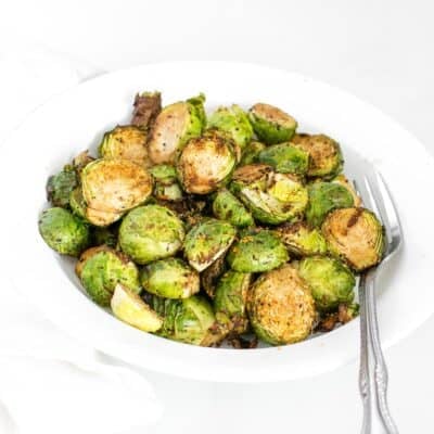 a 45 degree angle view of served air fryer brussels sprouts.