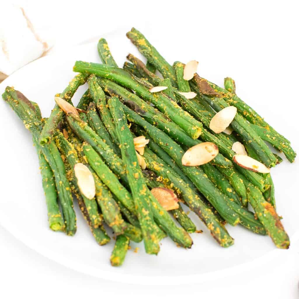 a close up view of served air fryer green beans. 
