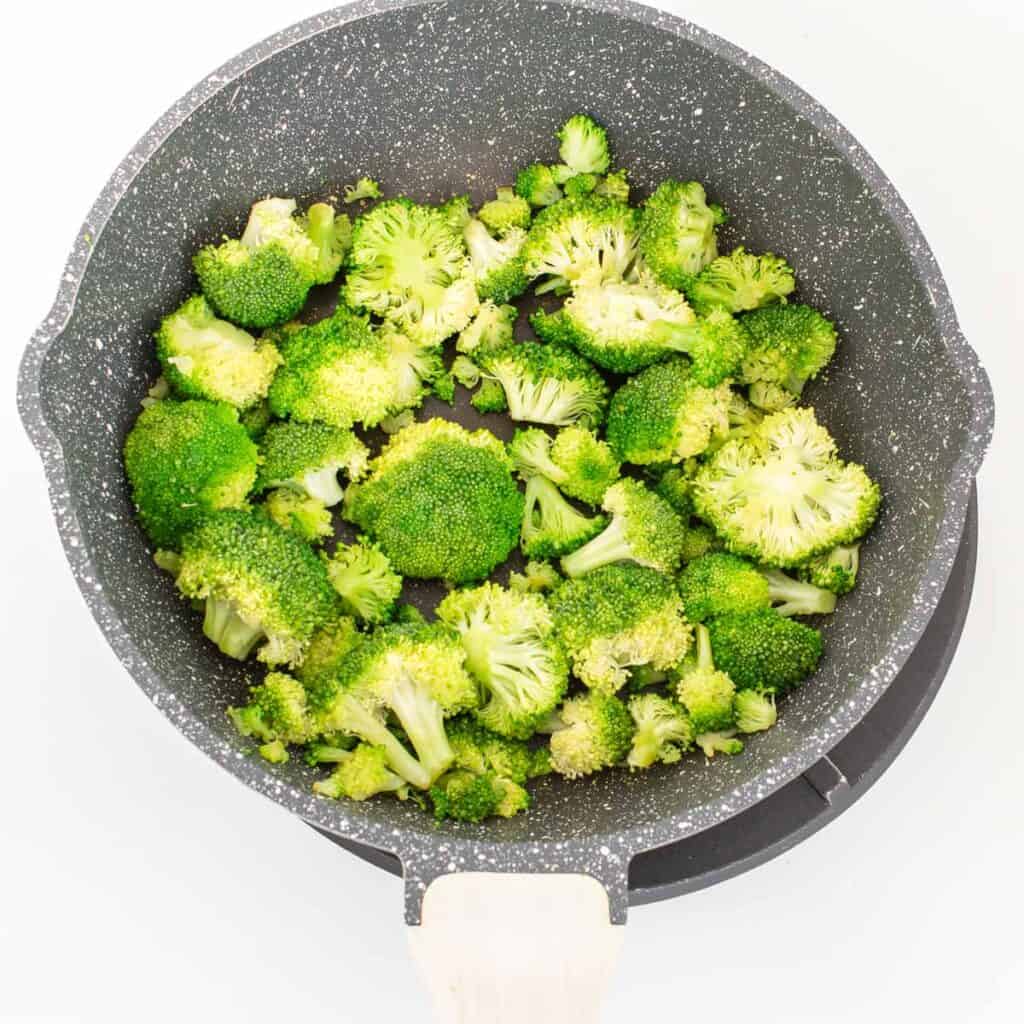 sauteed broccoli in a pan. 