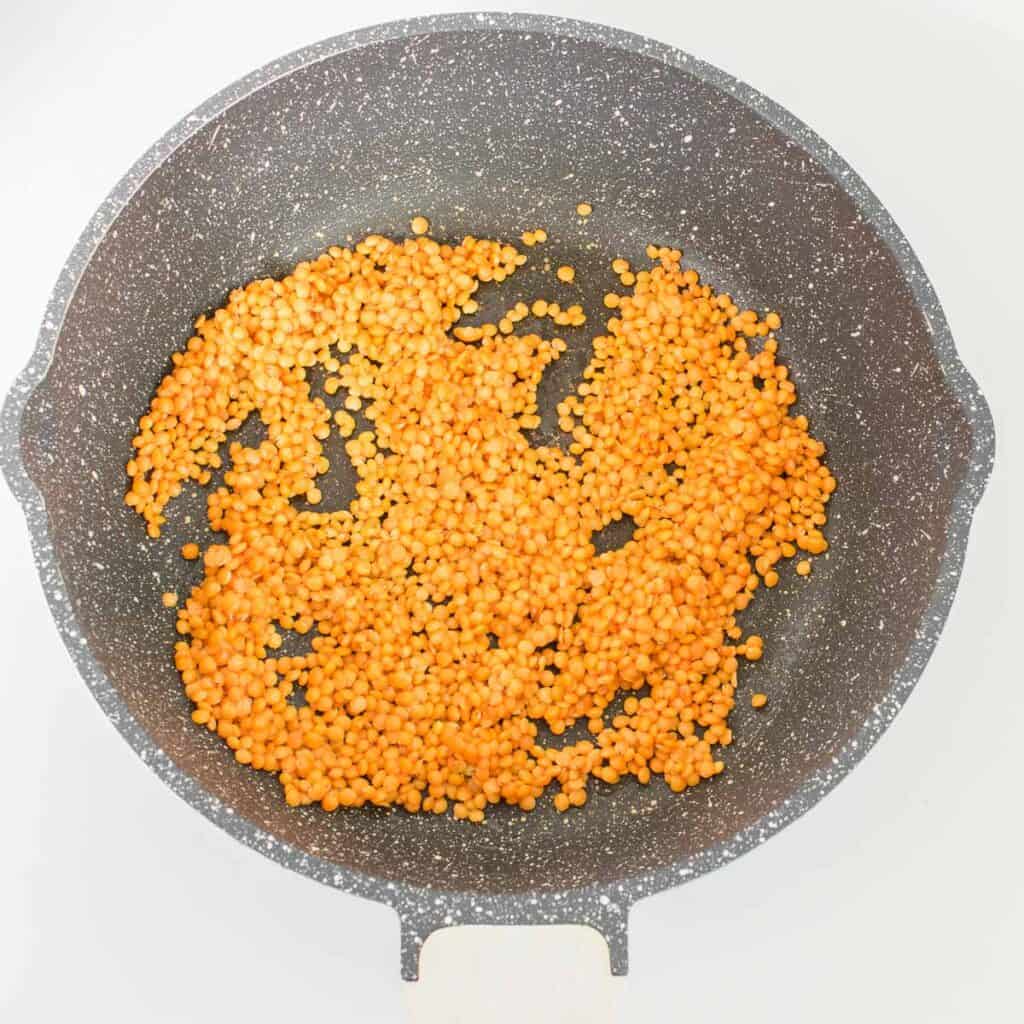 sauteed lentils in the pan. 