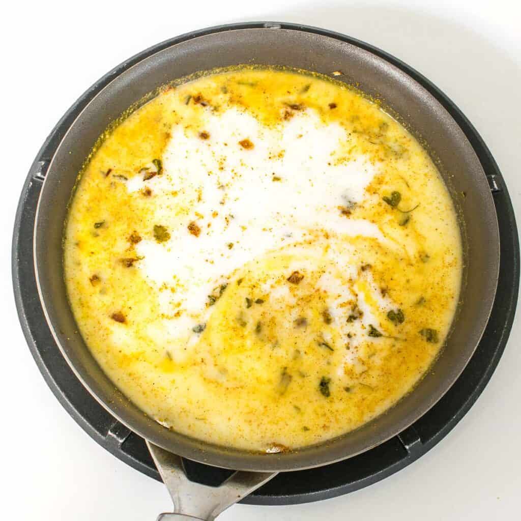 coconut milk along with salt and sugar added to the nonstick pan. 