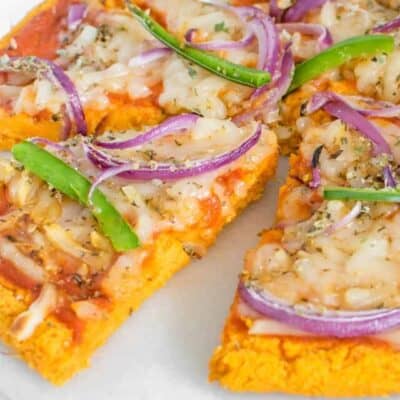 side angle view of the whole sweet potato pizza crust sliced.