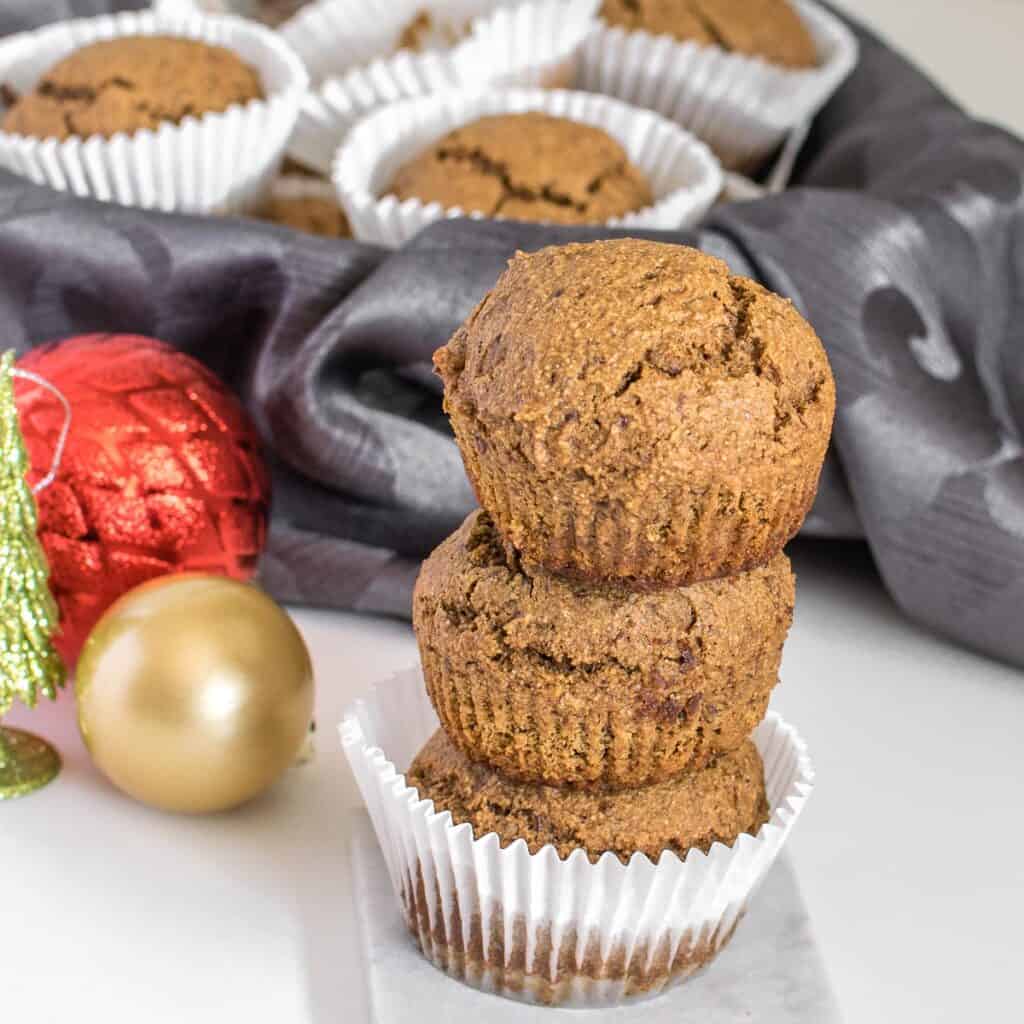 front view of stacked healthy gingerbread muffins. 