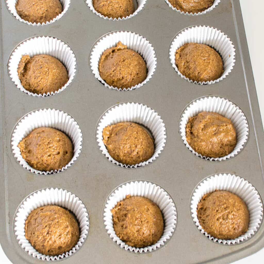 scooped batter in each cup of the muffin tray. 