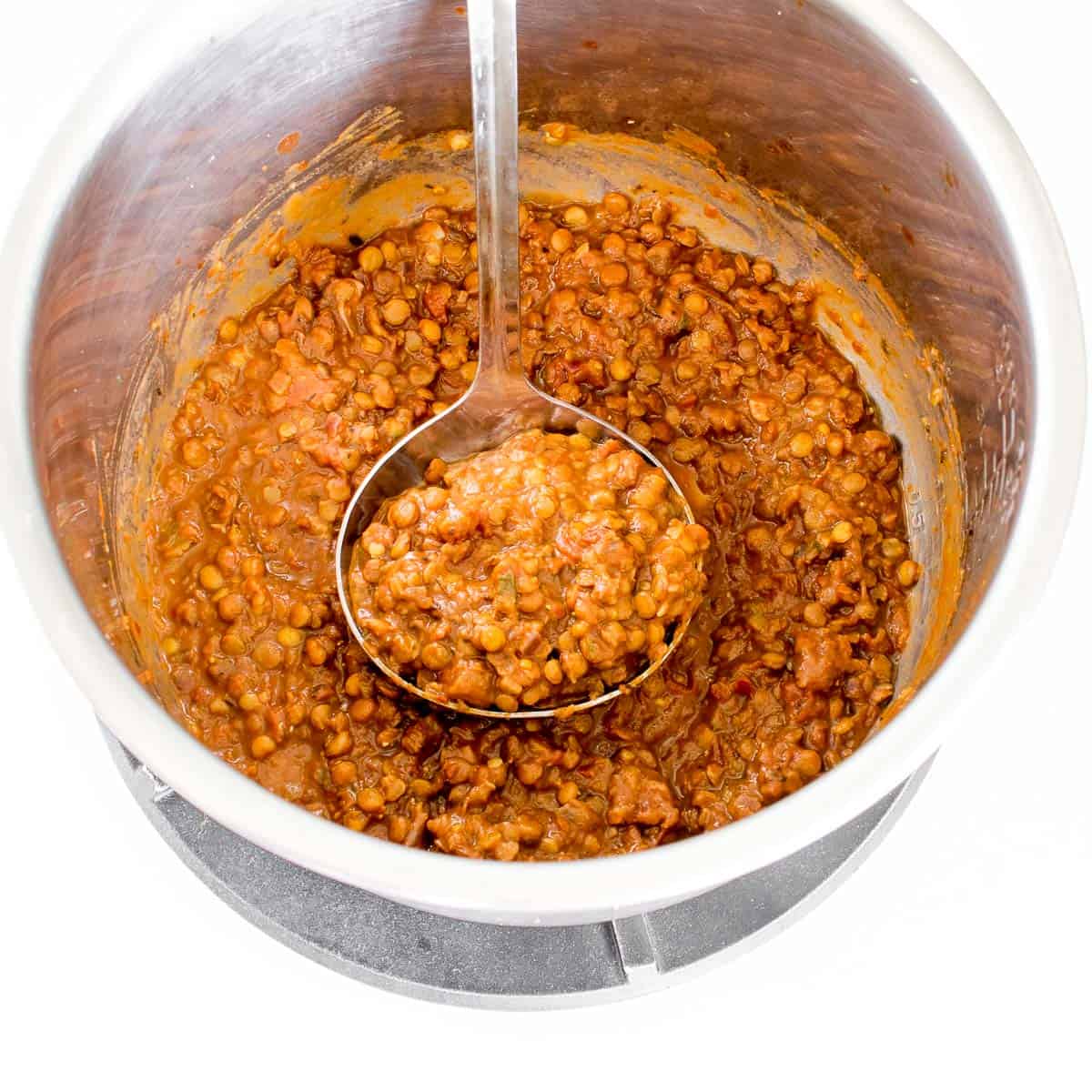 ladle full of vegan lentil Bolognese.