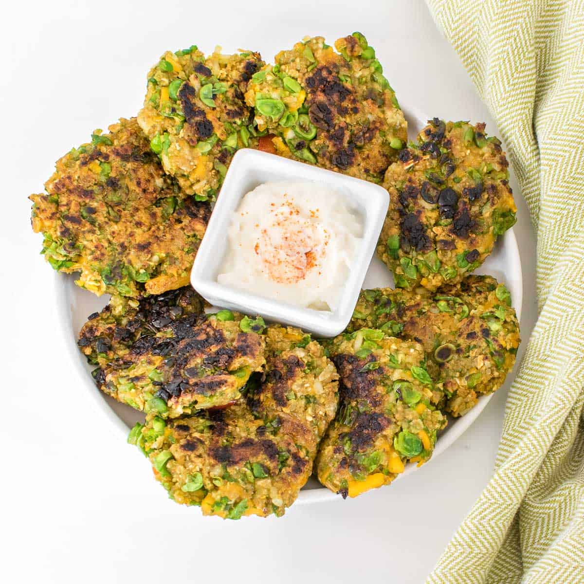 top view of served green pea fritters. 