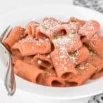 a close up view of served beetroot pink sauce pasta.