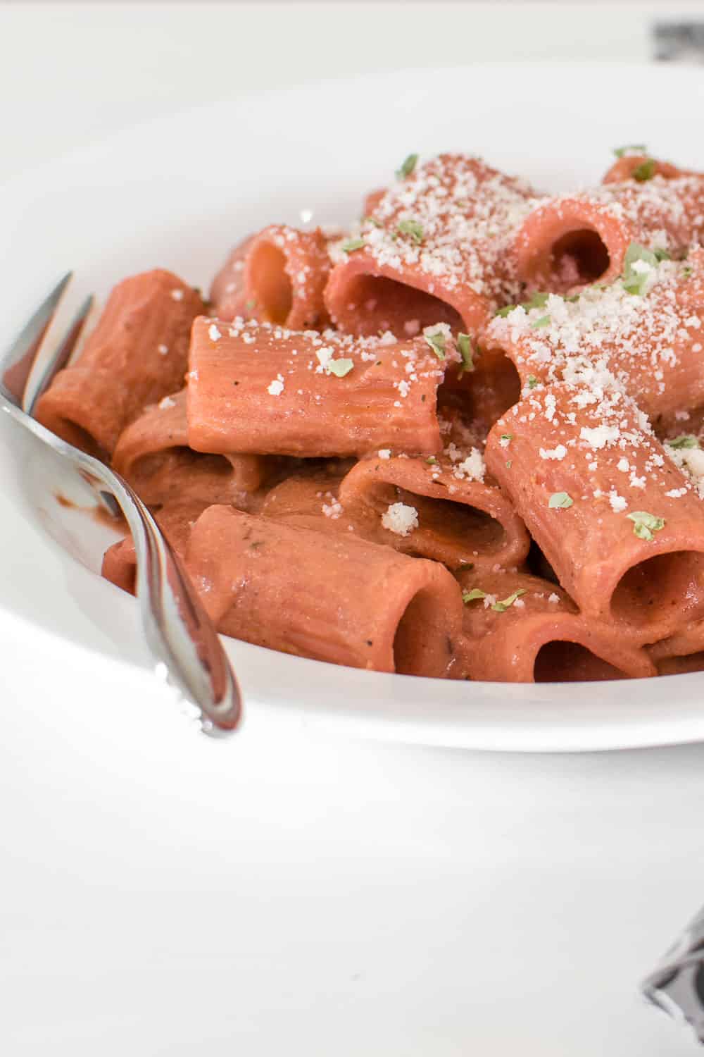 front view of served beetroot pink sauce pasta.