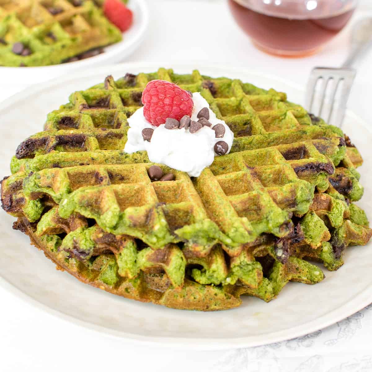 a 45 degree angle view of served green waffles.