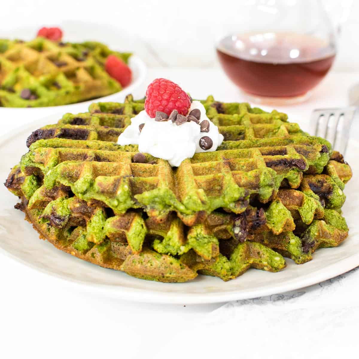 front view of stacked green waffles.