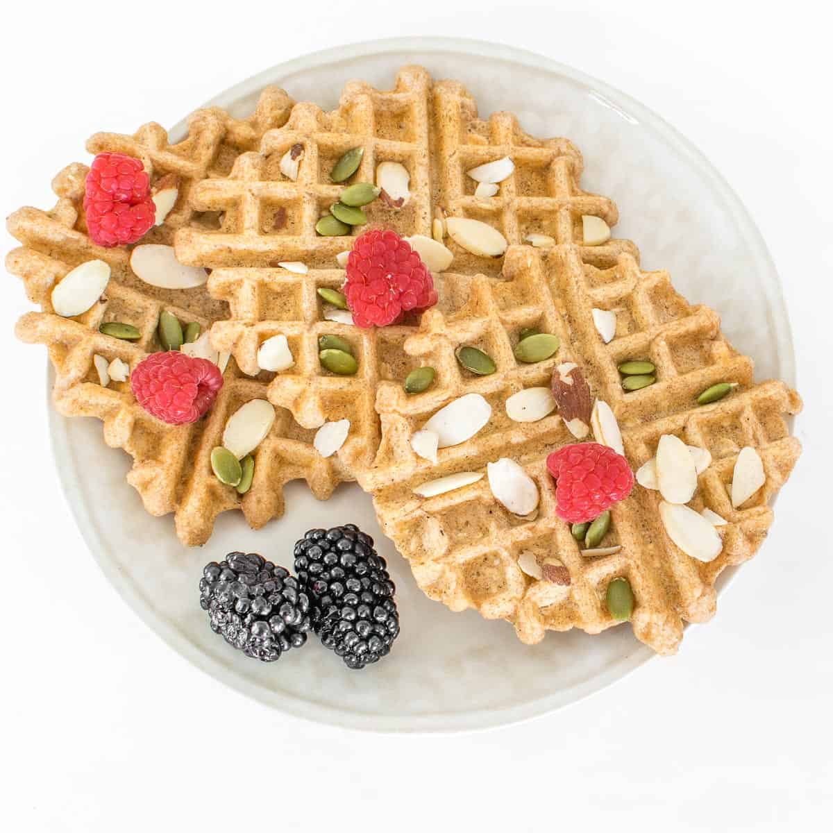 top view of vegan protein waffles with its toppings and garnishes. 