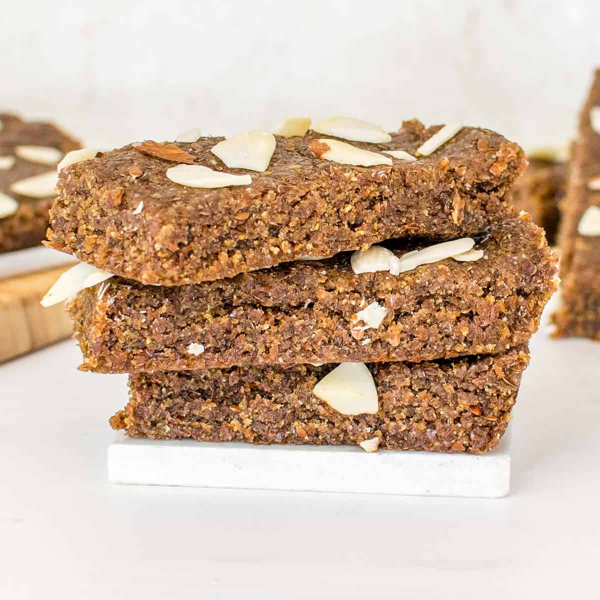 stacked flaxseed bars with a close up view.