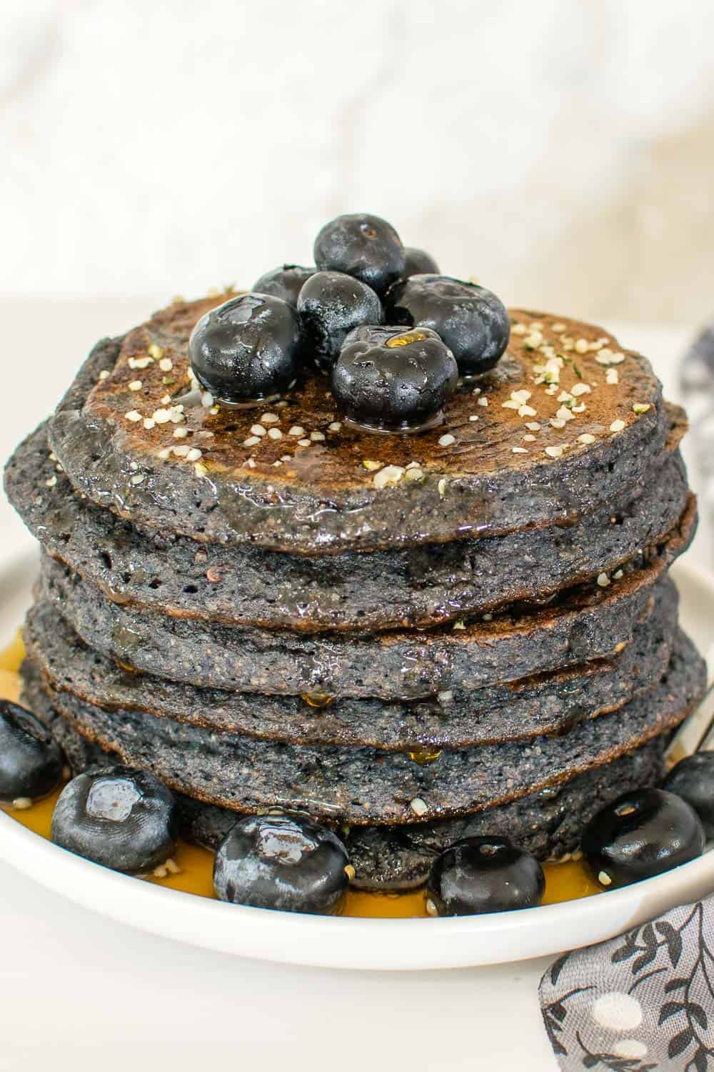 a front view of stacked vegan blueberry spelt flour pancakes. 