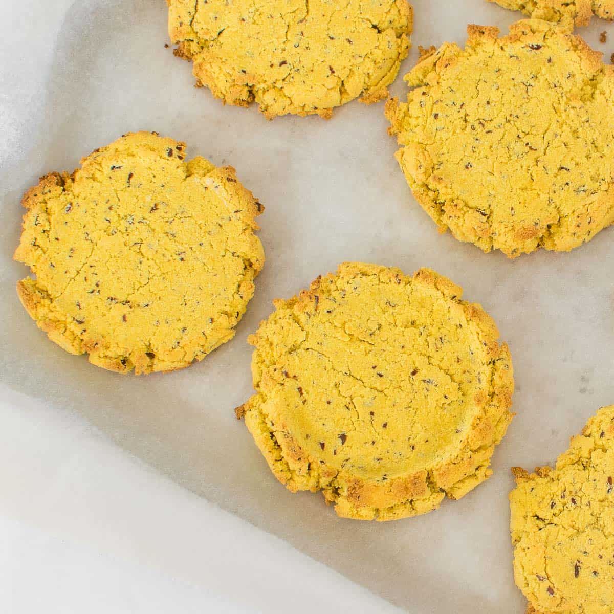 top view of baked mango coconut flour cookies in the baking sheet.