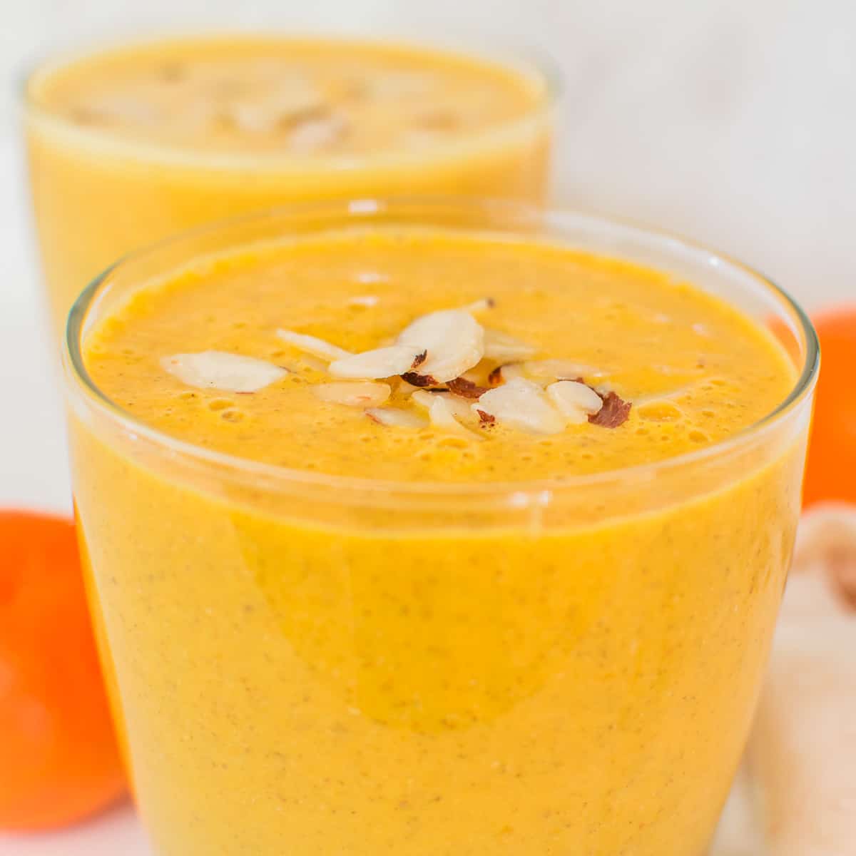 a close up view of orange smoothie. 