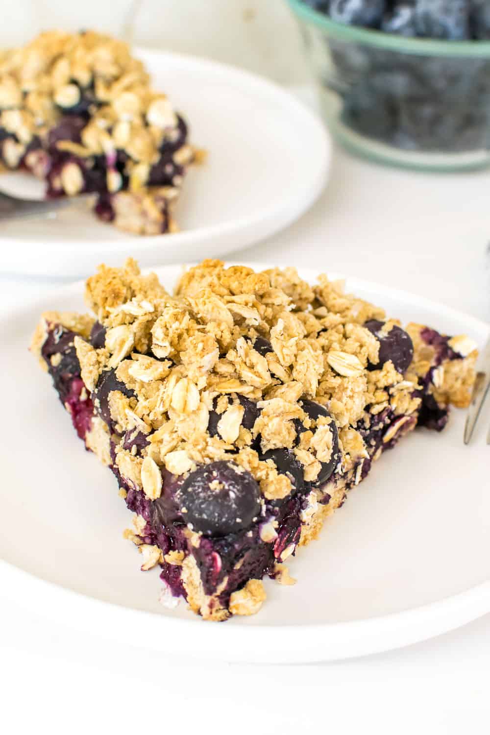 a front view of served slice of vegan blueberry pie.