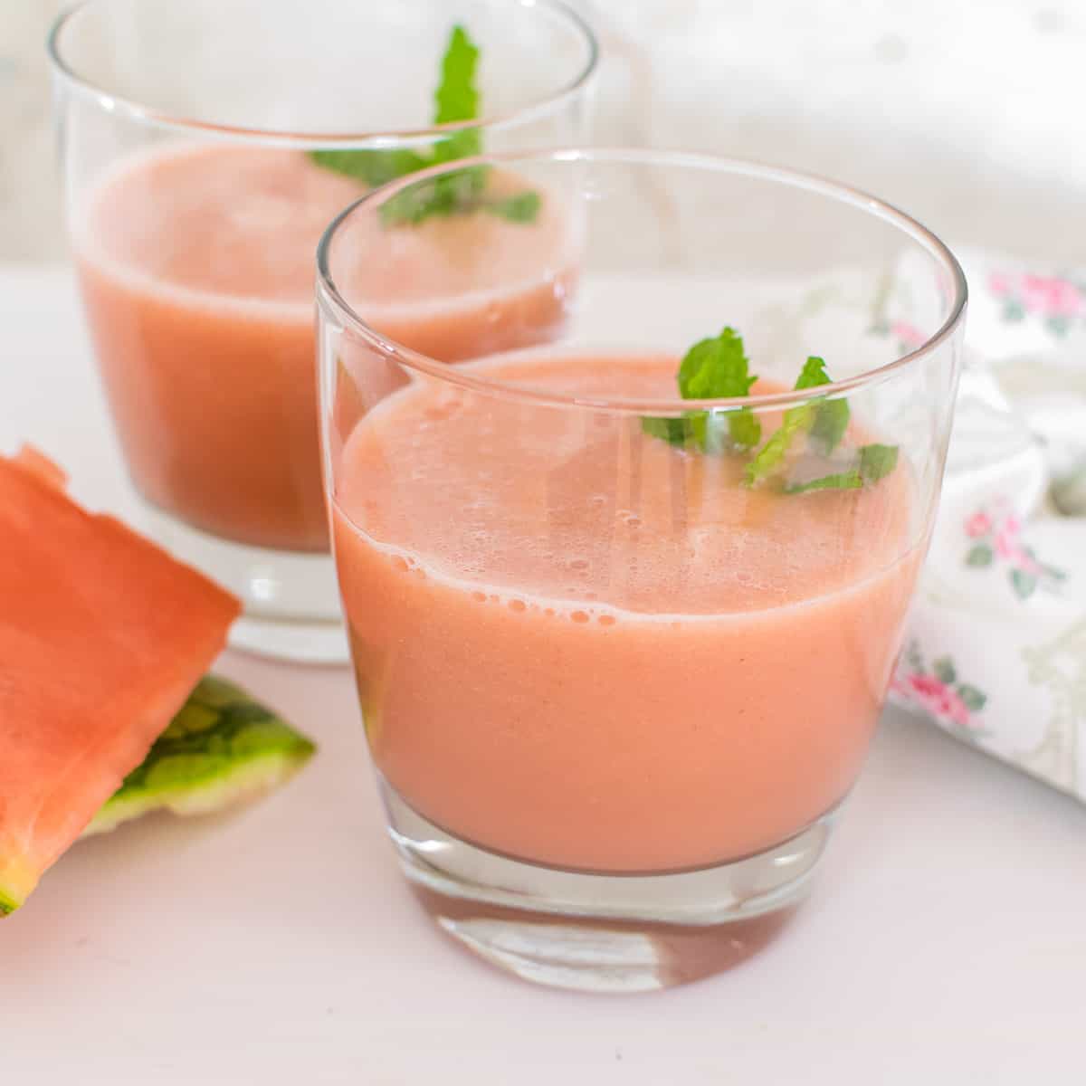 front view of served watermelon smoothie in serving glasses.