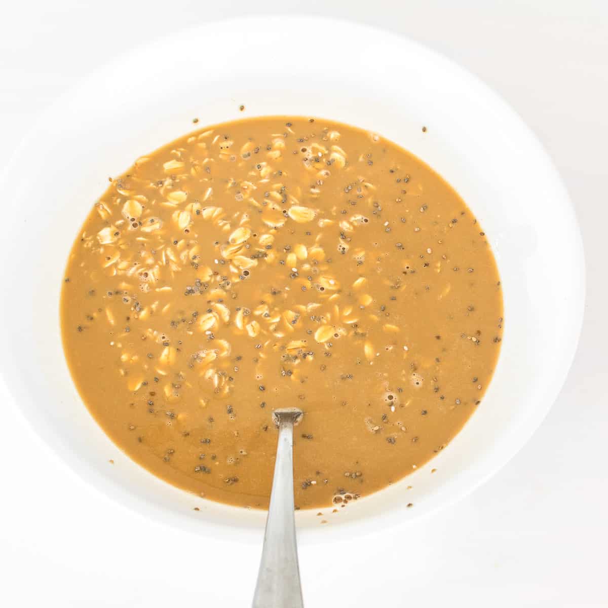 oat mixture folded in brewed coffee in a bowl. 