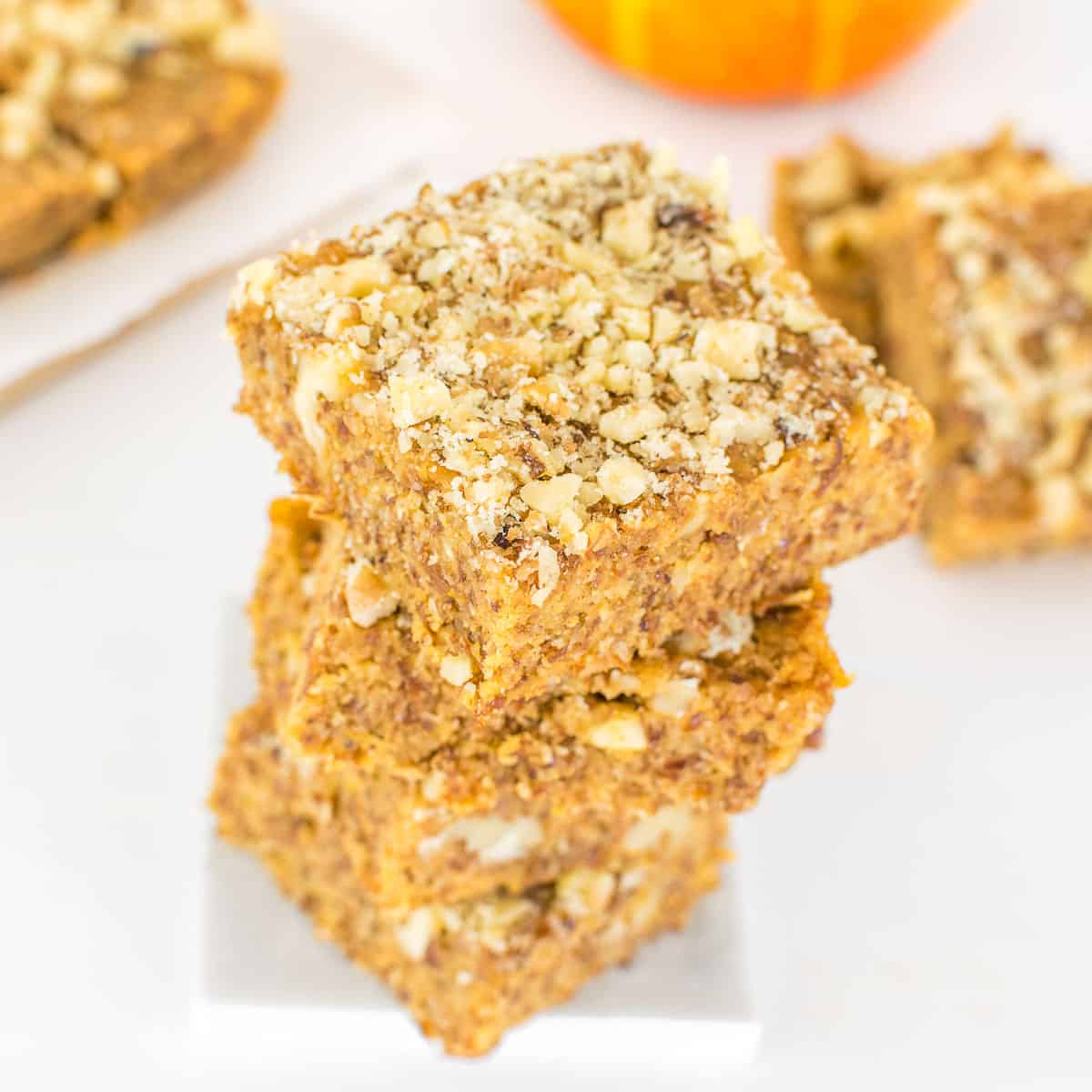 a 45 degree angle view of the stacked vegan pumpkin bars.