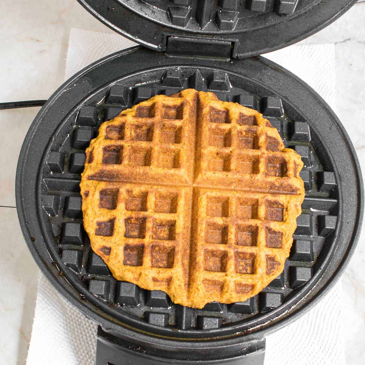 cooked pumpkin waffles in the waffle maker.