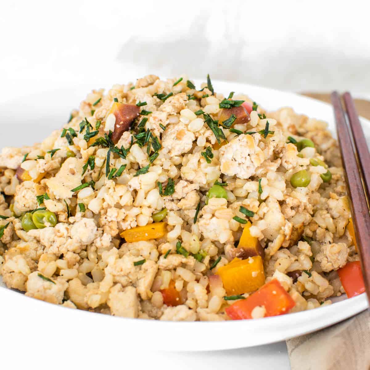 a front view of tofu fried rice in a serving dish.