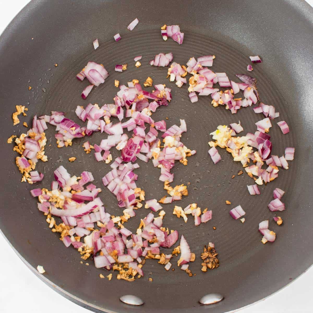 sauteed onion garlic in a pan.
