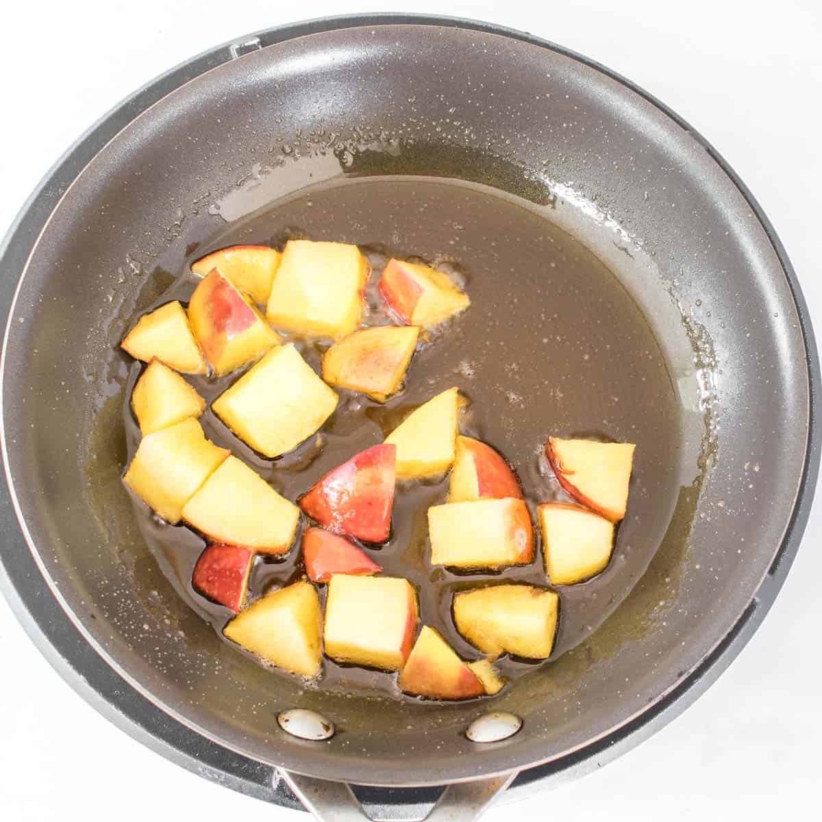 cooked apples in the pan.
