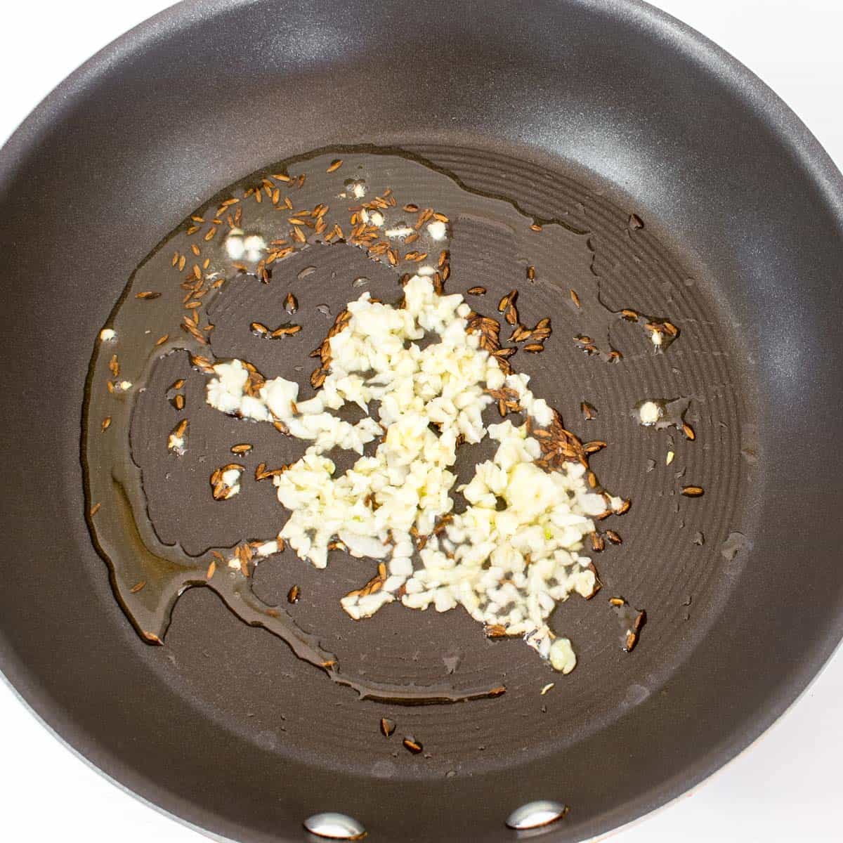 sauteed garlic in a pan.