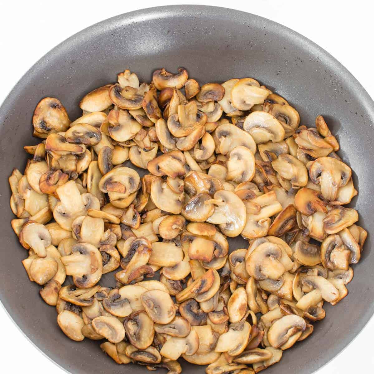 sauteed mushrooms in a pan.