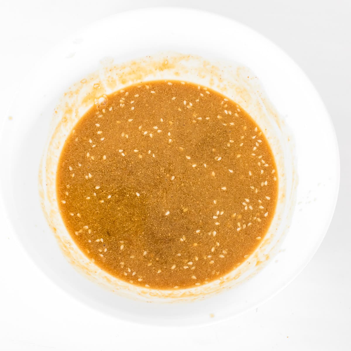 whisked sauce in a mixing bowl.