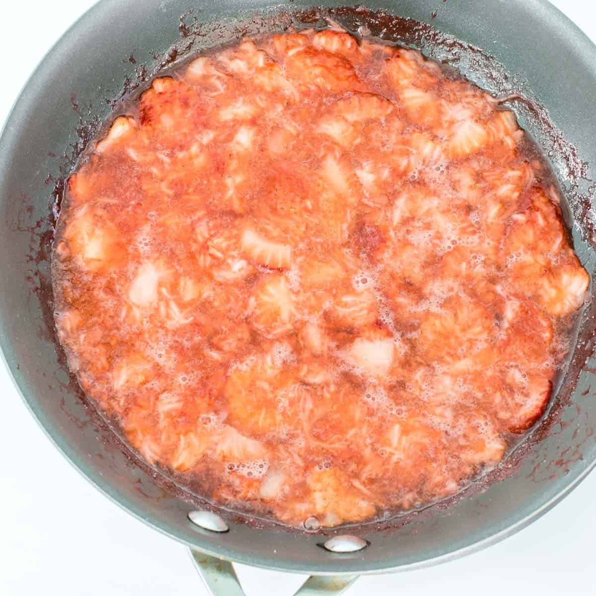 cooked strawberry sauce in the pan.