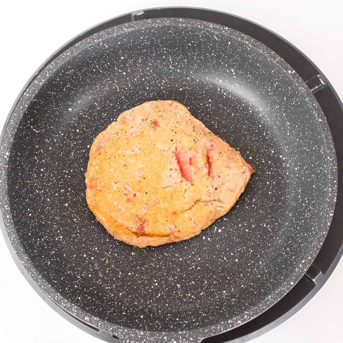 cooked strawberry pancake on the skillet.