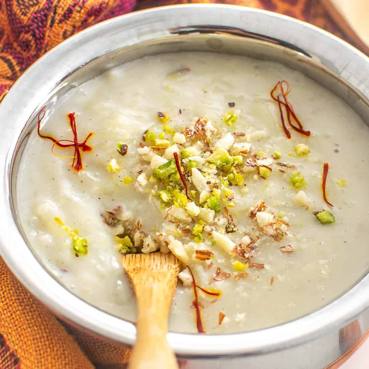 a close up view of the rice pudding with a spoon.