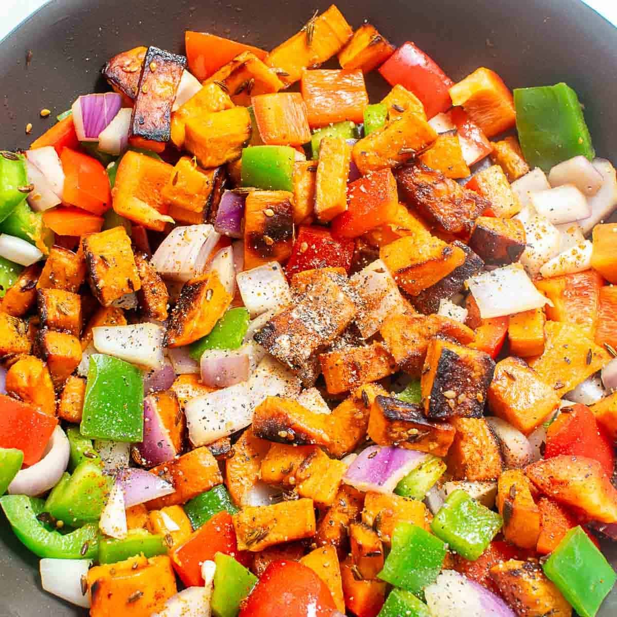 seasonings along with the veggies in the pan. 