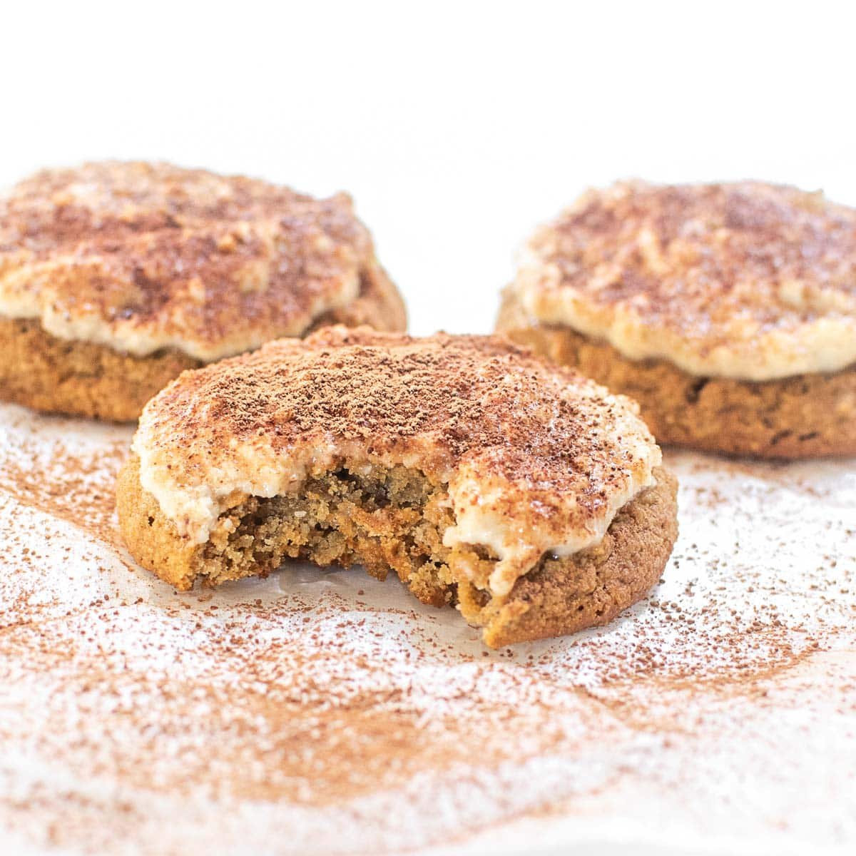 a close up front view of half eaten tiramisu cookie.