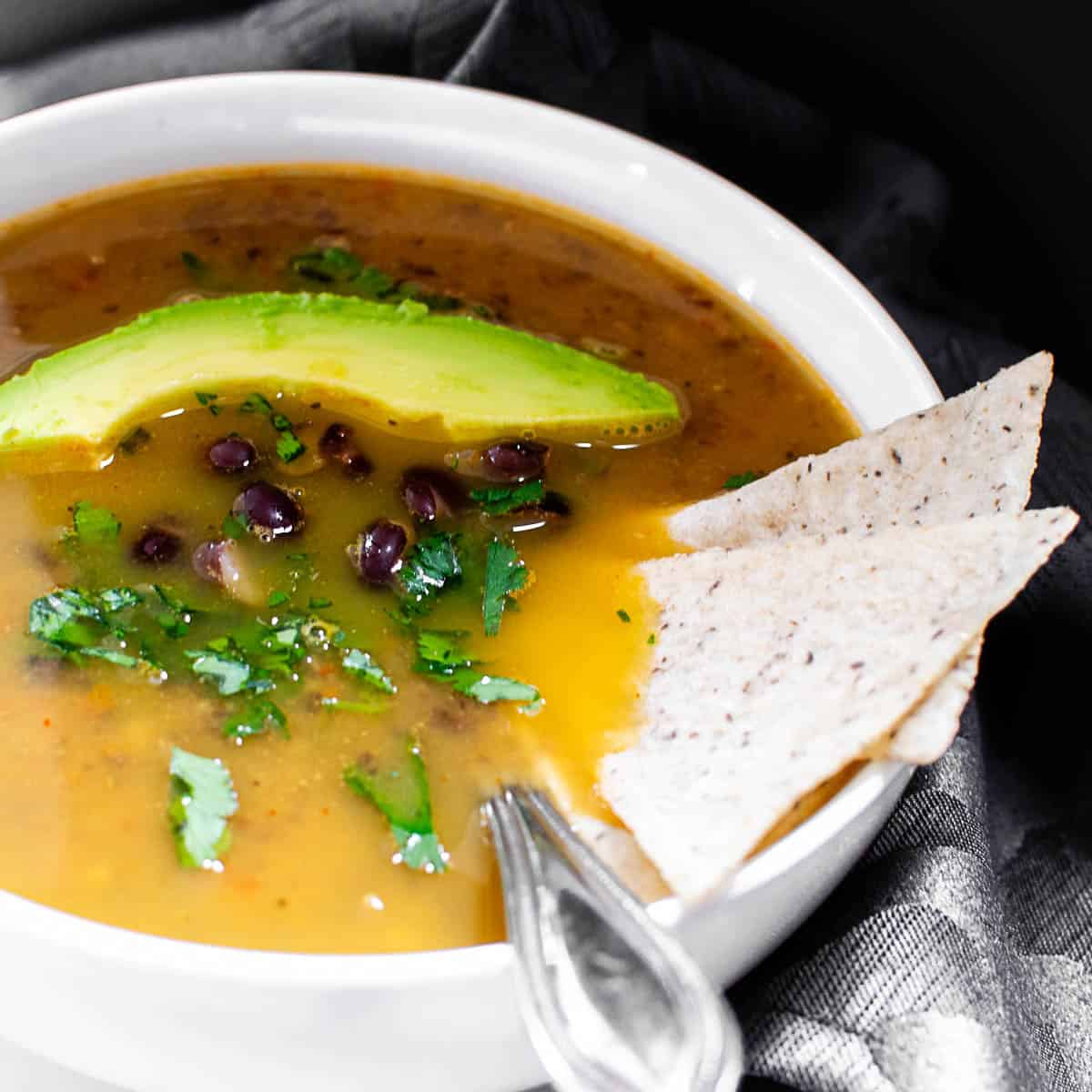 a close up view of served black bean soup.